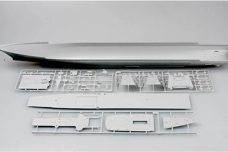 Unassembled grey plastic model ship hull and deck components from the Trumpeter 1/350 Russian Admiral Lazarev battlecruiser kit.
