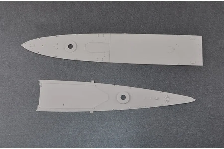 Two grey plastic model ship deck sections from a 1/350 scale Trumpeter model kit on a dark grey background.