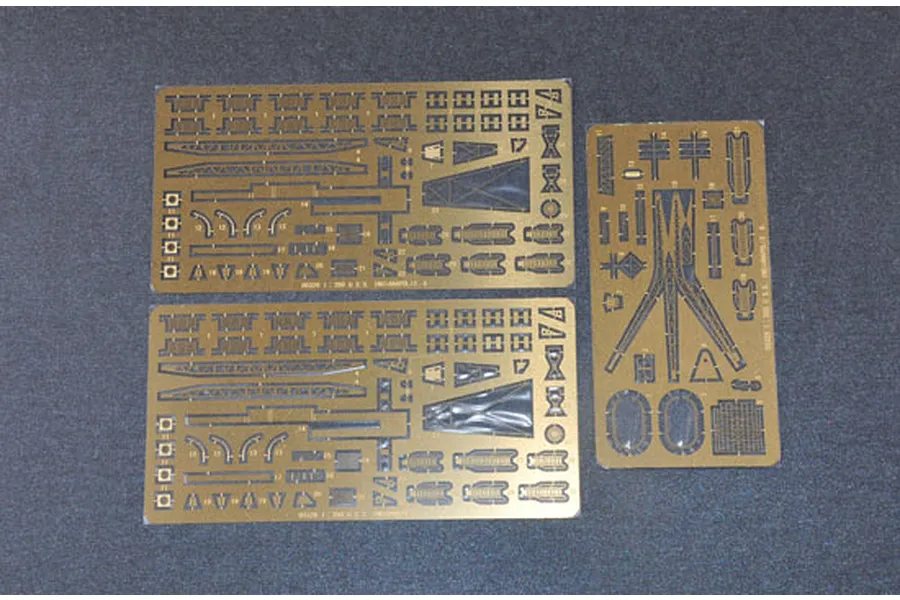 Three photo-etched brass detail sheets for a 1/350 scale model ship kit, laid out on a dark grey surface.