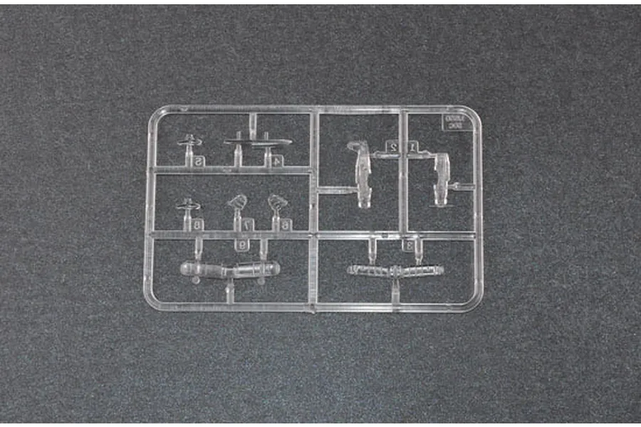 A clear plastic sprue containing small aircraft parts for a 1/350 scale model kit, set against a dark grey textured background.