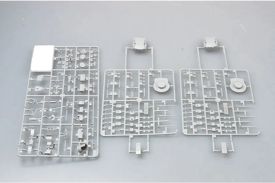 Three grey plastic model kit sprues containing various small parts for a 1/350 scale ship model.