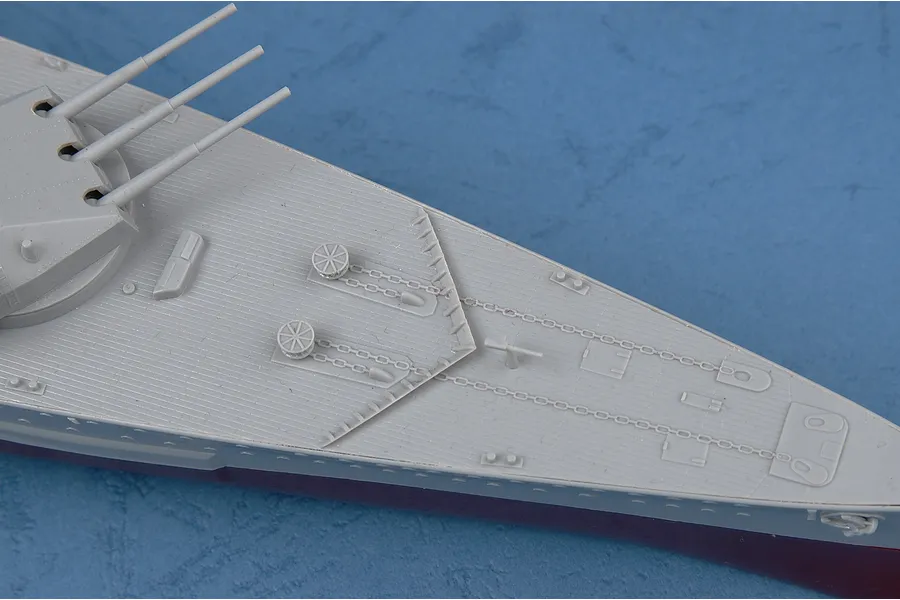 Close-up of the bow section of a 1/350 scale Admiral Graf Spee plastic model ship, showing the deck, anchor chains, and forward gun turret.