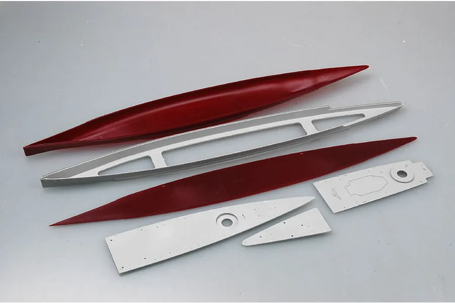 Unassembled plastic model ship hull and deck components from a Trumpeter model kit on a plain background.
