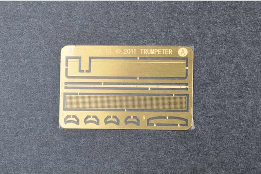 A photo-etched brass fret for a 1/35 scale Trumpeter model kit, featuring various small parts including a mesh screen and brackets.