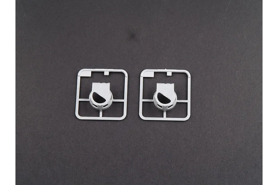 Two identical grey plastic model kit sprues each containing a single circular tank turret component.