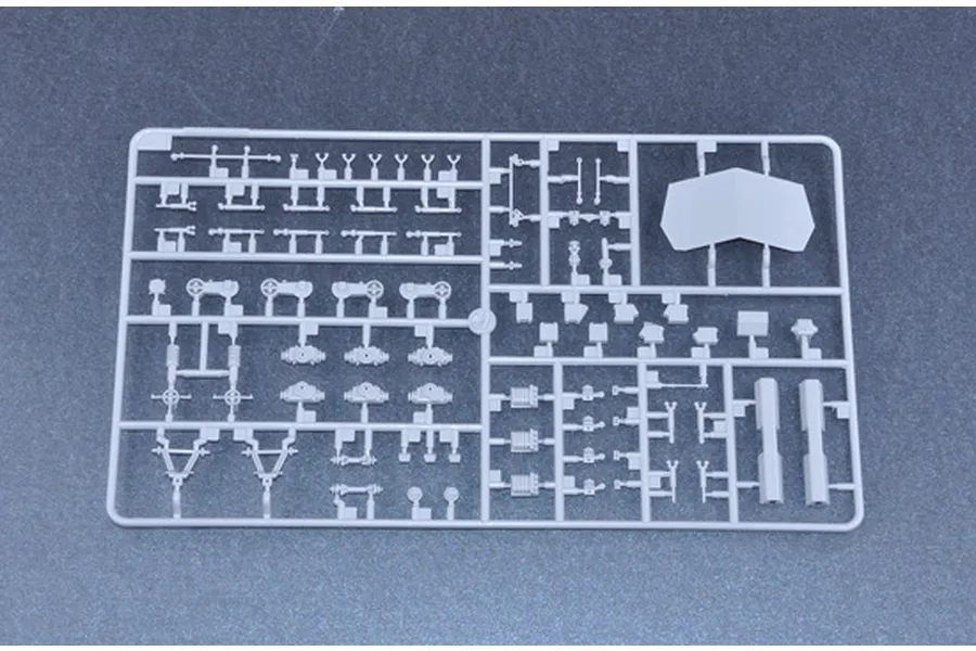 A grey plastic sprue containing various small model parts for the Trumpeter 1/35 Canadian Husky 6x6 AVGP model kit.