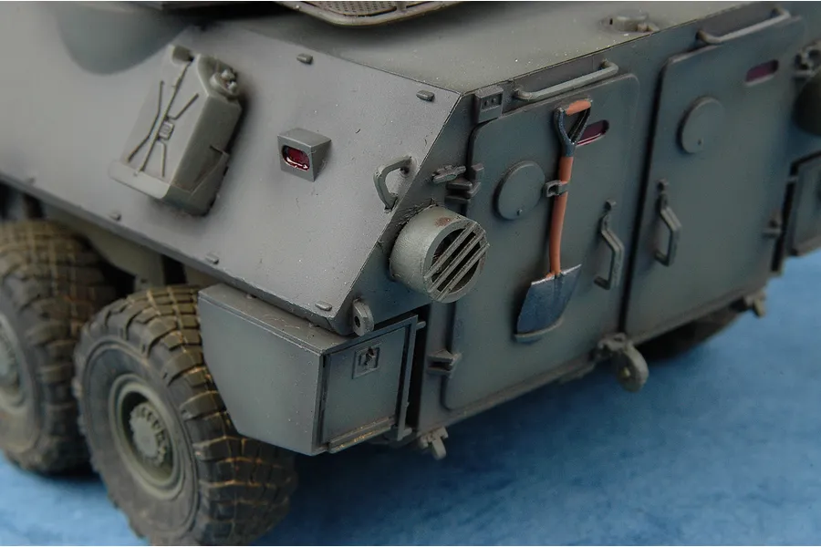 Close-up of the rear section of a 1/35 scale plastic model of a Canadian Cougar AVGP armoured vehicle, showing detailed exterior features.
