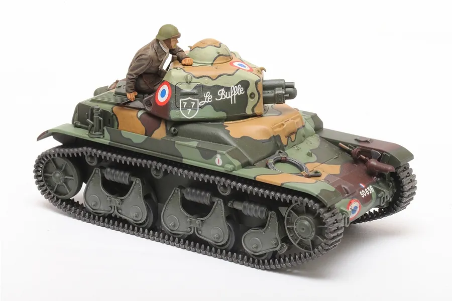 A fully assembled and painted 1/35 scale Tamiya French R35 tank model with a crew figure in the turret hatch, featuring a multi-colour camouflage pattern.
