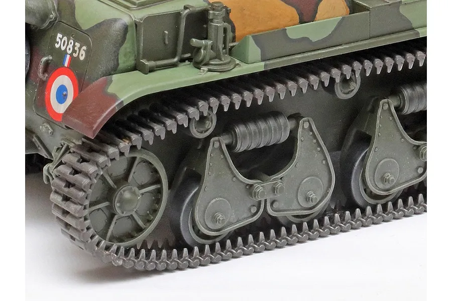 Close-up of the tracks and suspension system on a painted 1/35 scale Tamiya French R35 tank model kit.