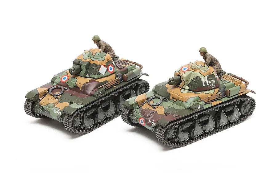 Two assembled and painted 1/35 scale Tamiya French R35 tank models with crew figures, featuring camouflage paint schemes on a white background.