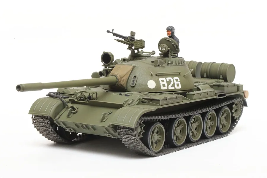 A fully assembled and painted 1/48 scale Tamiya Russian T-55 medium tank model kit, featuring olive green paint, a tank commander figure, and number 826.