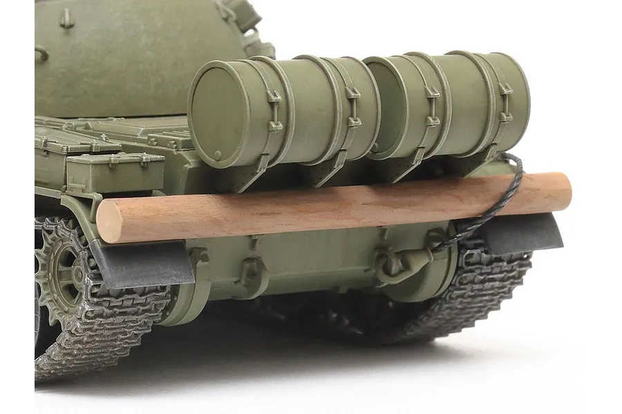 Rear view of a Tamiya 1/48 scale Russian T-55 tank model showing fuel drums and a wooden log attached to the hull.