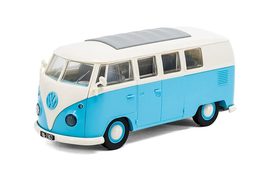A studio shot of an assembled blue and white Airfix Quickbuild Volkswagen Kombi Camper Van model kit on a white background.