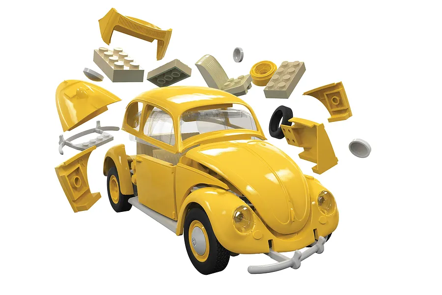 Exploded view of a yellow Airfix Quickbuild Volkswagen Beetle model car kit showing various plastic components and the partially assembled vehicle.