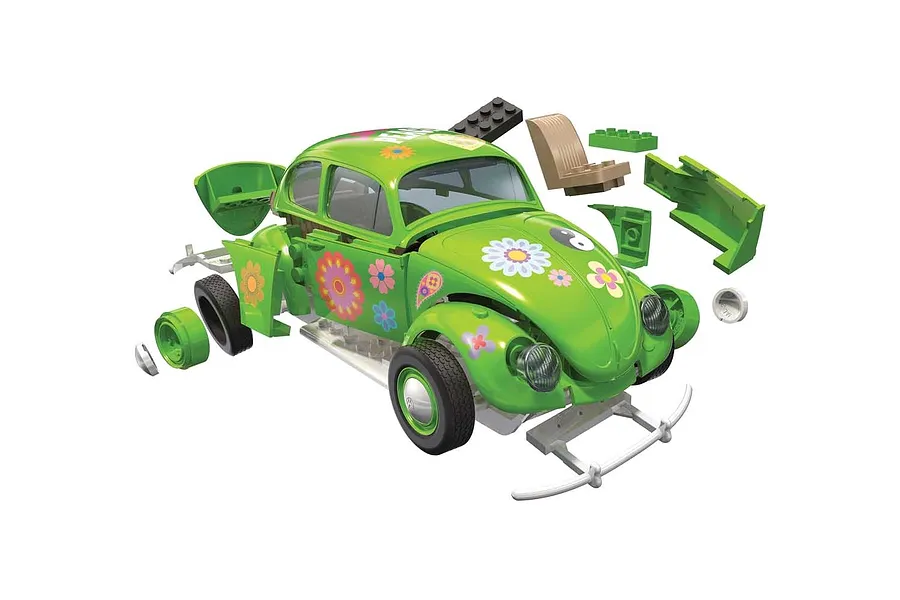Airfix Quickbuild Volkswagen Beetle model kit in green with flower power decals, shown partially assembled with loose components floating around it.