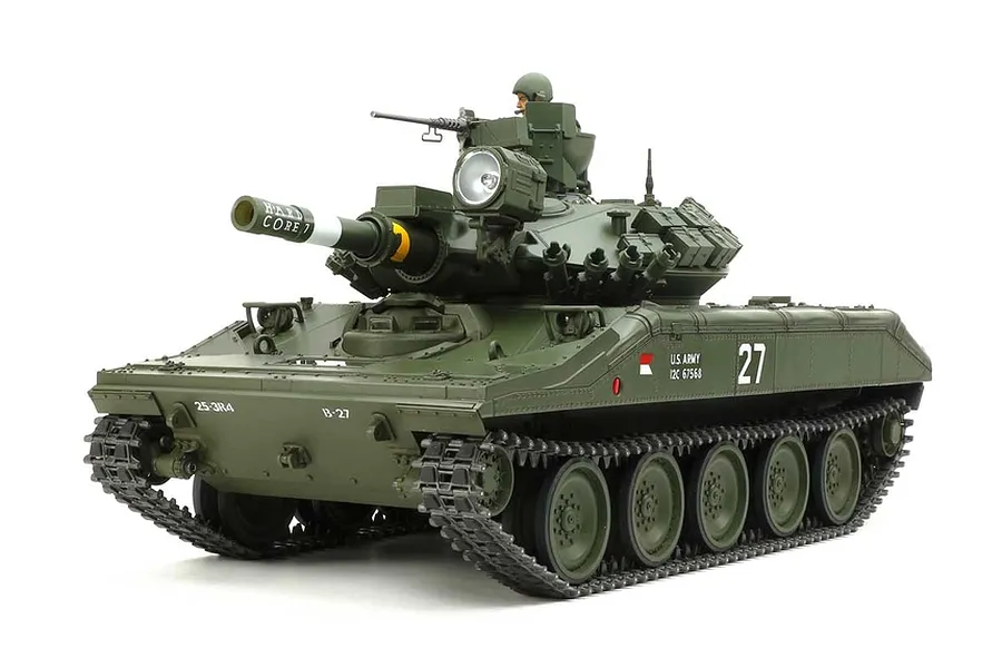 A studio shot of a Tamiya 1/16 scale M551 Sheridan RC tank model, painted in olive drab with military markings and a commander figure.