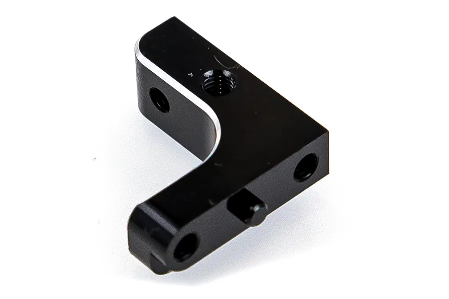 A black anodized aluminium servo mount for RC vehicles, shown from an angled perspective against a white background.