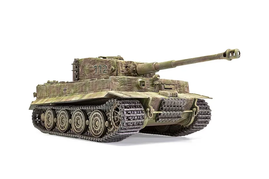 A fully assembled and painted 1/35 scale model of a German Tiger I tank with zimmerit coating and camouflage paint scheme, viewed from the front-right angle.