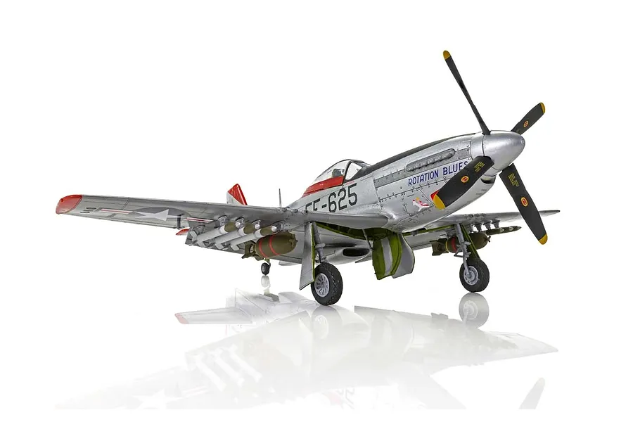 A fully assembled and painted 1/48 scale model of a North American F-51D Mustang fighter plane, featuring a silver finish with red accents and 'Rotation Blues' markings.