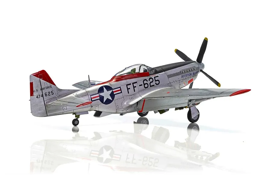 A fully assembled and painted 1/48 scale model of a North American F-51D Mustang fighter aircraft, featuring a silver finish with red and black markings.