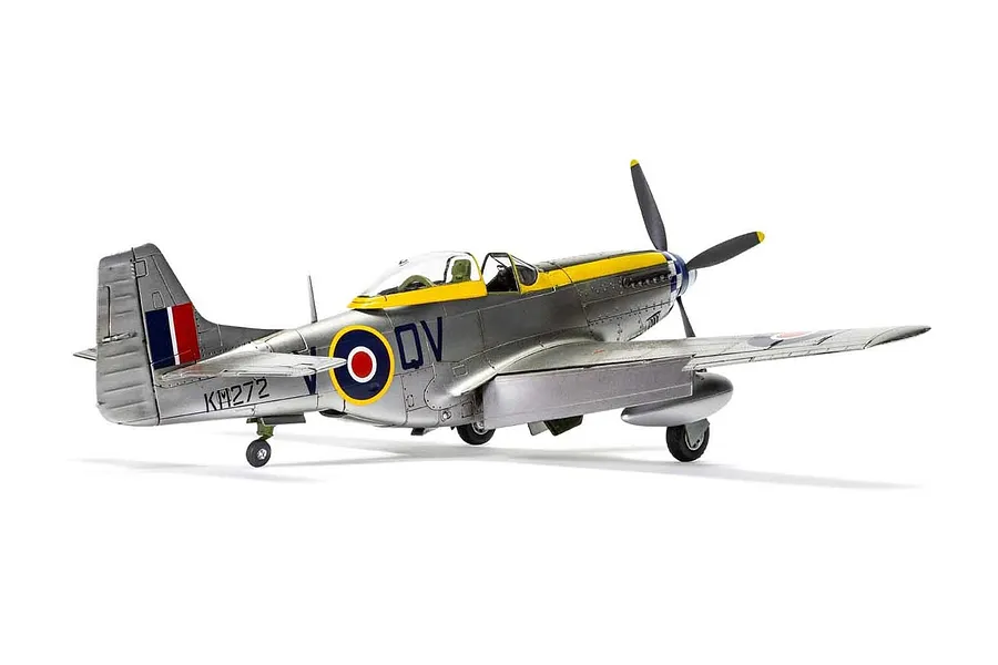 A fully assembled and painted 1/48 scale model of a North American Mustang Mk.IV fighter aircraft in silver with yellow nose markings.