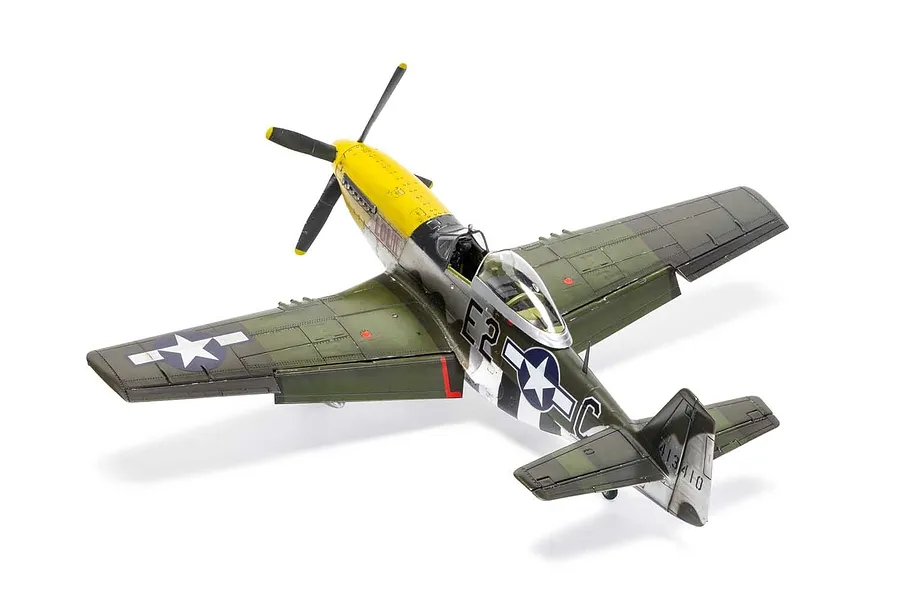 A completed 1/48 scale plastic model of a North American P-51D Mustang fighter plane with olive green and silver finish against a white background.