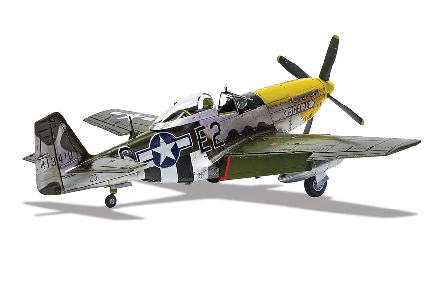 A completed 1/48 scale plastic model of a P-51D Mustang fighter plane, painted in silver, olive drab, and yellow with 'KATHELENE' markings.