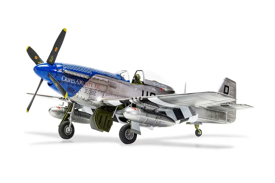A fully assembled and painted 1/48 scale plastic model of a North American P-51D Mustang fighter plane, featuring a blue nose and silver fuselage.
