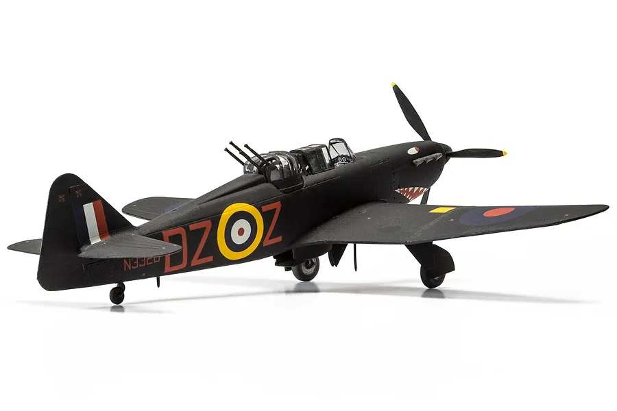 A 1/72 scale plastic model of a black Boulton Paul Defiant fighter aircraft with RAF markings and shark mouth nose art on a white background.