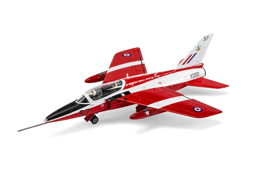 A fully assembled and painted 1/72 scale plastic model of a Folland Gnat T.1 jet trainer in red and white livery, shown on a white background.