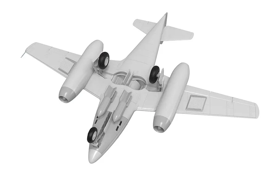 A 3D render of an unpainted plastic model of a Messerschmitt Me 262 jet aircraft, viewed from below showing the landing gear and bombs.