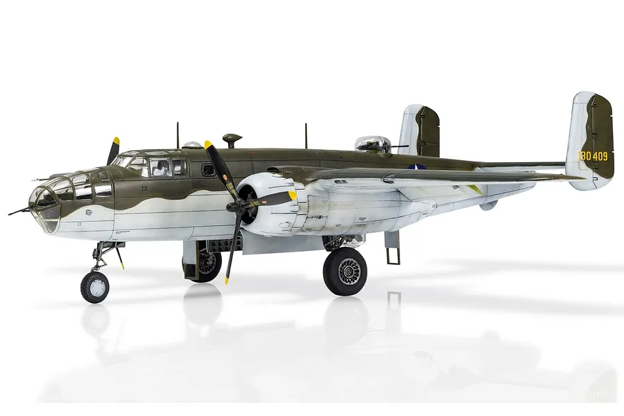 A completed 1/72 scale plastic model of a North American B-25 Mitchell bomber, painted in olive drab and grey camouflage with landing gear down.