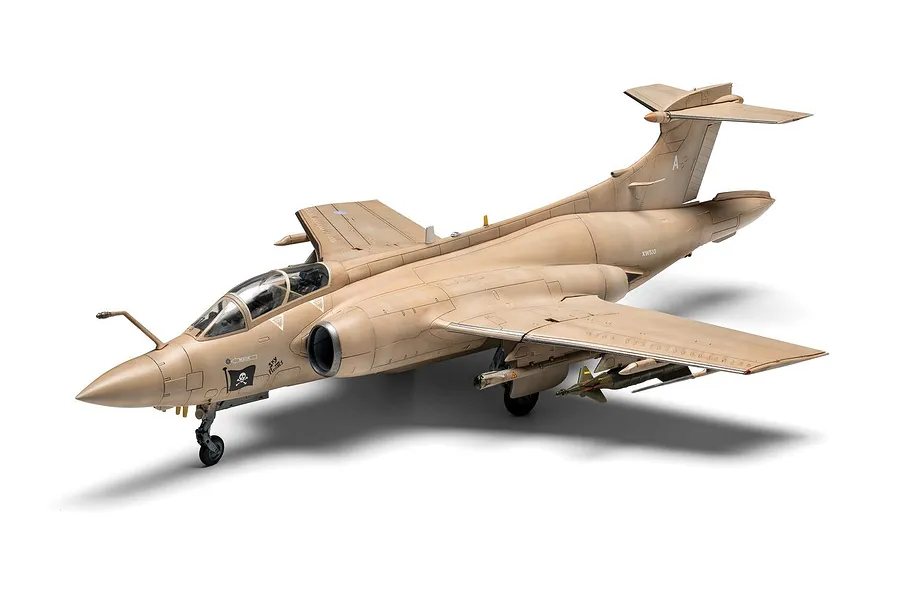 A completed 1/72 scale plastic model of a tan RAF Blackburn Buccaneer S.2 attack aircraft with a Jolly Roger emblem on the nose.