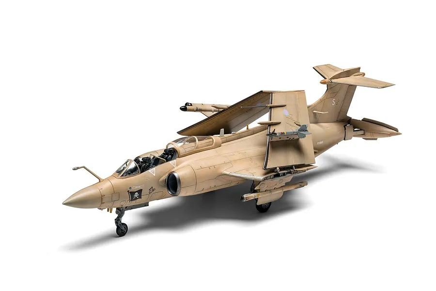 A fully assembled and painted 1/72 scale model of a tan RAF Blackburn Buccaneer S.2 attack aircraft with folded wings, displayed against a white background.