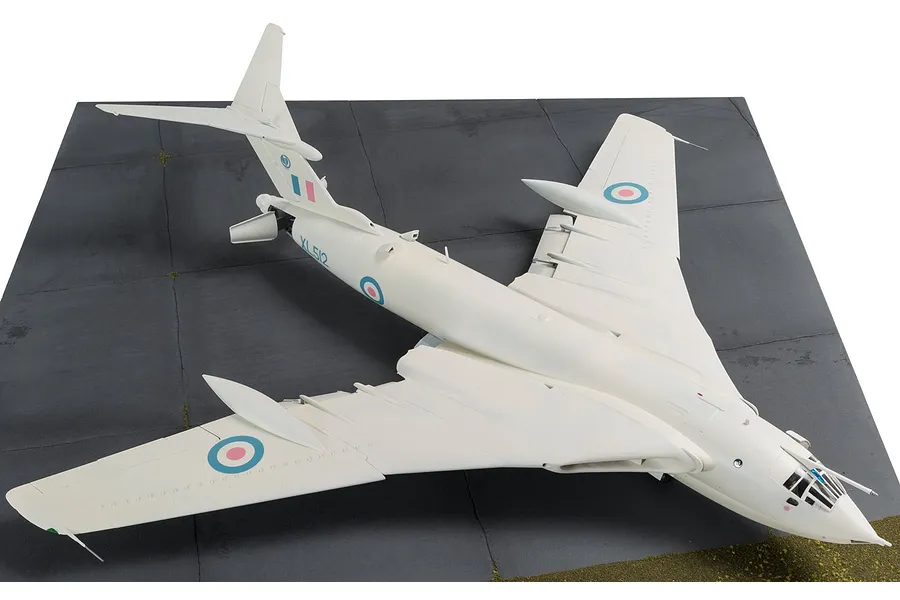 A high-angle view of a finished 1/72 scale Handley Page Victor B.2 model aircraft, painted white with RAF markings, displayed on a simulated tarmac base.
