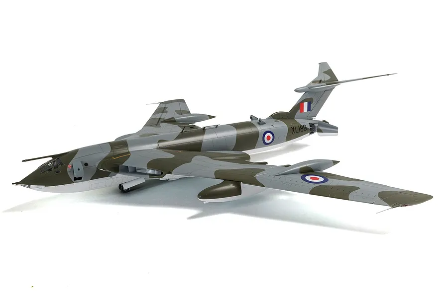 A fully assembled and painted 1/72 scale plastic model of a Handley Page Victor B.2 bomber in camouflage livery, viewed from a high rear angle.