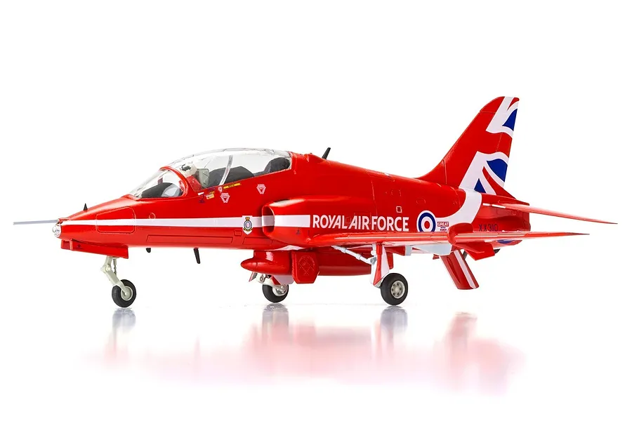 A side profile view of a fully assembled Airfix 1/72 scale RAF Red Arrows Hawk trainer model aircraft, painted in iconic red with Union Jack tail markings.