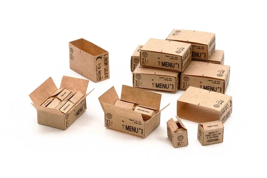 A collection of miniature cardboard ration boxes for 1/35 scale military models, featuring various sizes and printed labels.