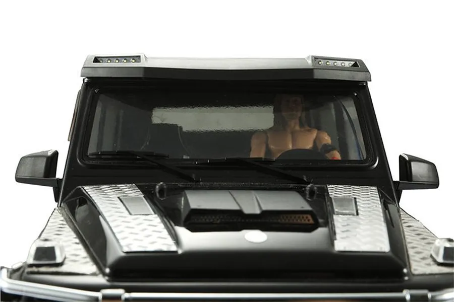 Close-up of a black RC car hood featuring silver diamond plate tread accessories installed on the bonnet.