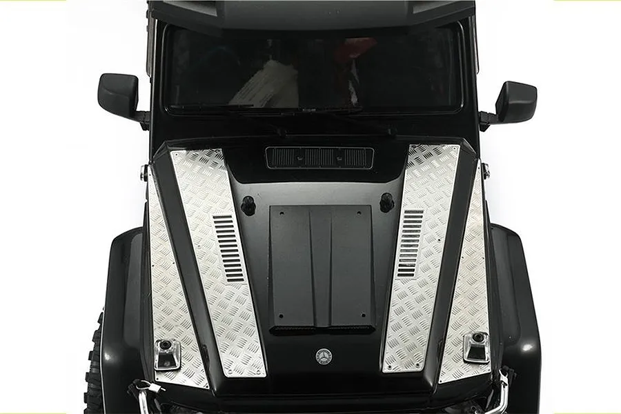 Top-down view of a black RC car hood featuring silver stainless steel tread plate accessories installed on either side.