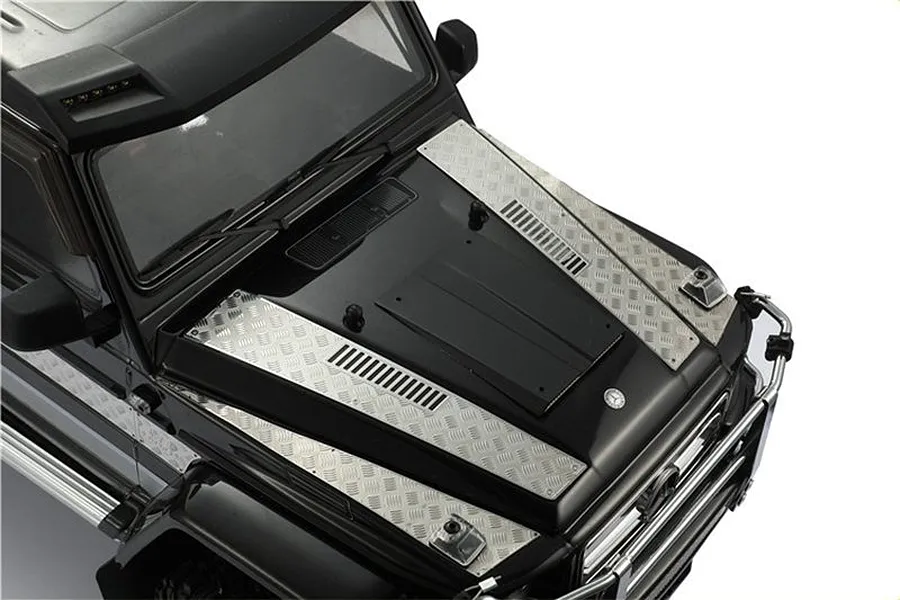 Close-up of a black RC Mercedes-Benz G-Wagon hood fitted with silver stainless steel tread plate accessories.