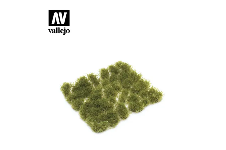 A collection of Vallejo 6mm dense green grass tufts arranged on a white background with the Vallejo logo in the top left corner.