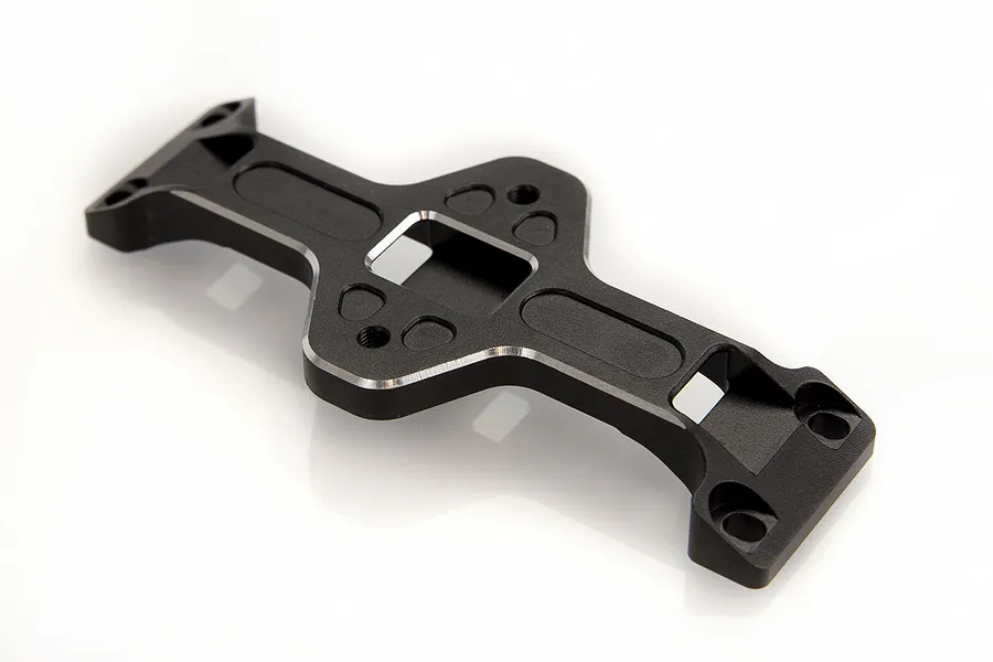 A black anodized aluminium RC car battery tray mount with silver chamfered edges on a white background.