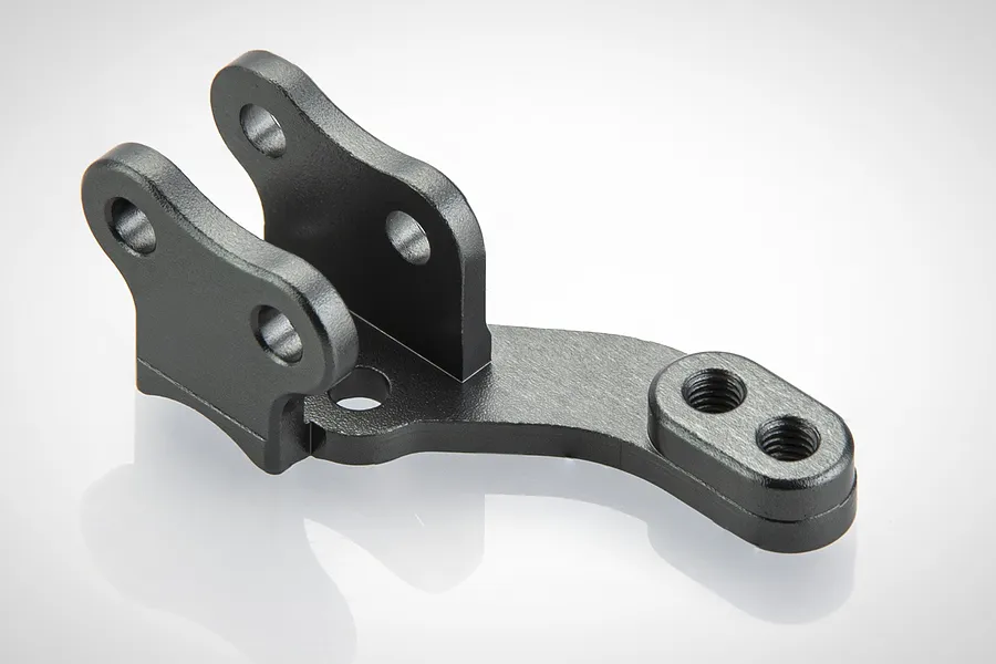 A black aluminium lower panhard mount for an RC car, featuring a U-shaped bracket and a mounting arm with two threaded holes.