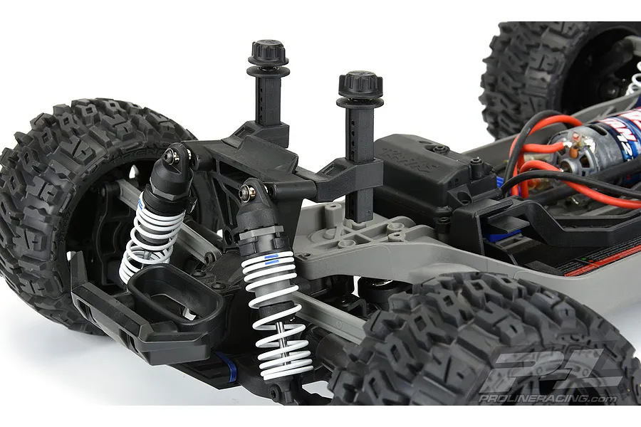Pro-Line extended body mounts installed on the rear of a Traxxas Rustler 4x4 RC vehicle chassis.
