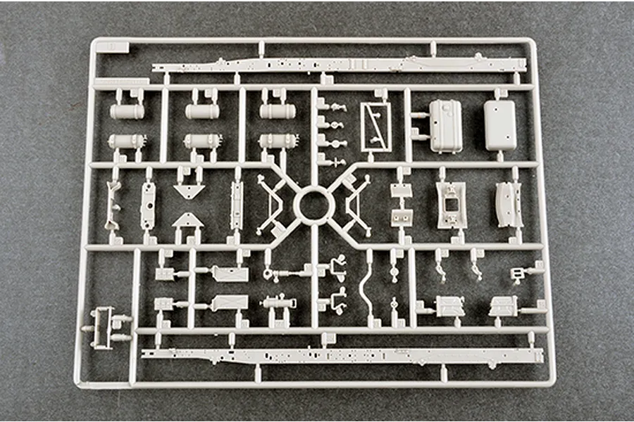 A light grey plastic model kit sprue containing various vehicle chassis and mechanical parts for a 1/35 scale military model.