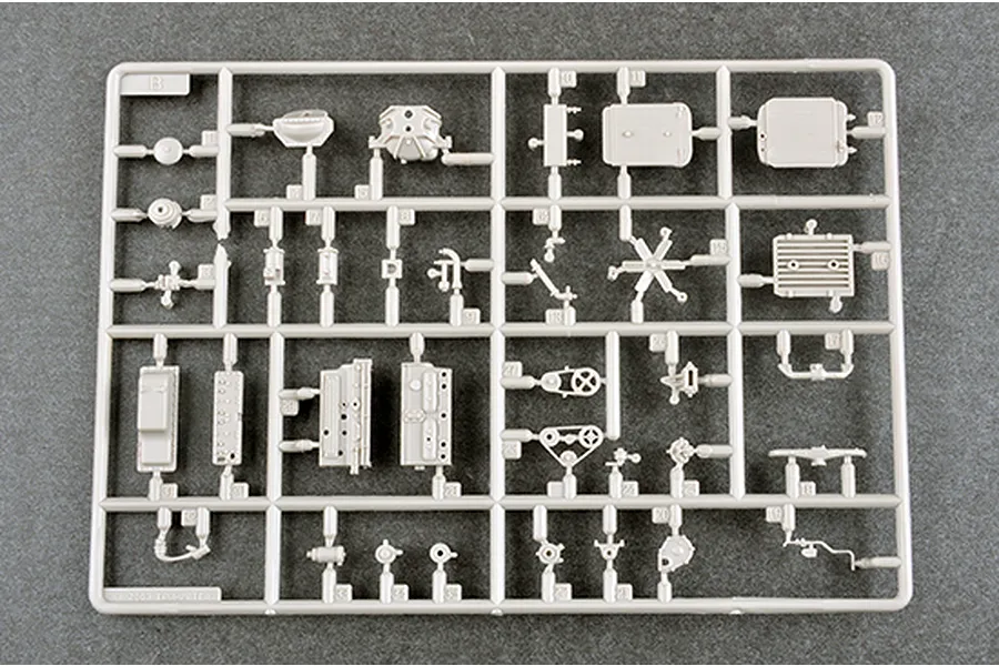 A grey plastic sprue from a Trumpeter 1/35 scale model kit containing various engine and mechanical components.