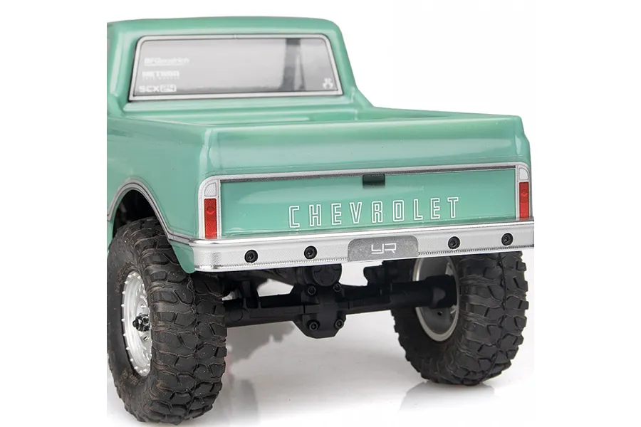 Rear view of a light green RC truck showing the Yeah Racing silver aluminium rear bumper installed.
