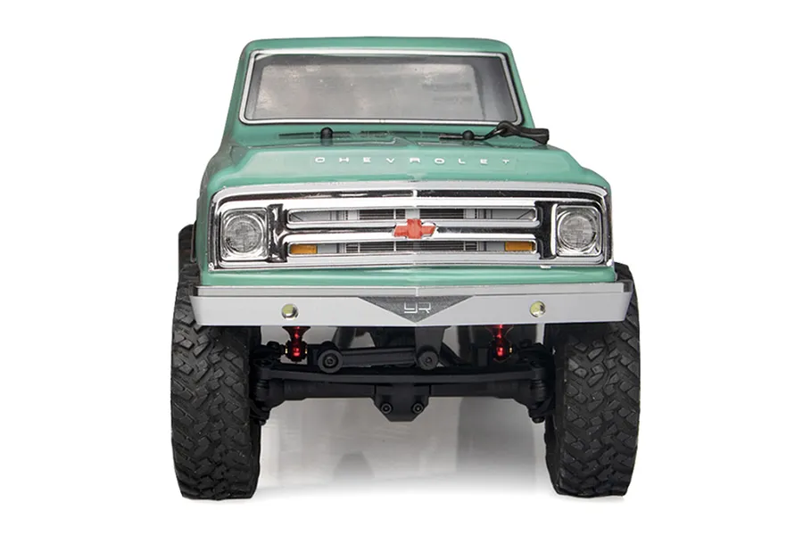 Front view of a light green RC Chevrolet C10 truck body installed with a silver Yeah Racing aluminium front bumper.