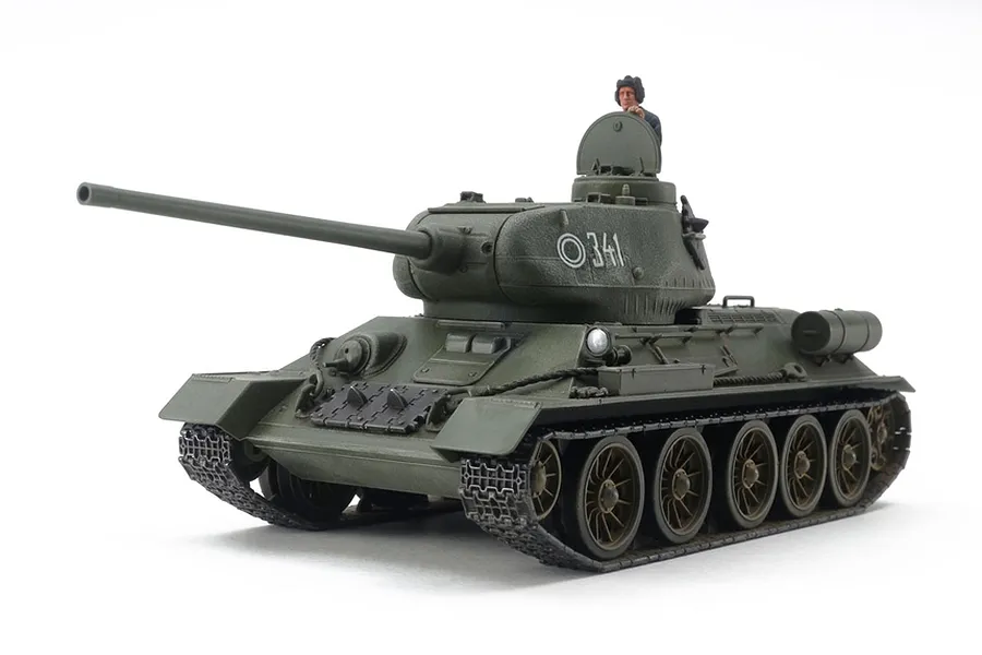 A fully assembled and painted Tamiya 1/48 scale Russian T34/85 tank model with a crew figure in the hatch.
